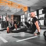 Man and women working out at Plutoniq Fitness